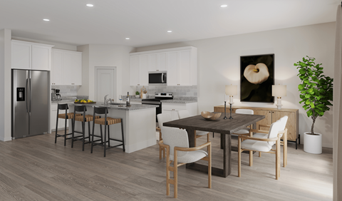 a kitchen and dining room with a table and chairs